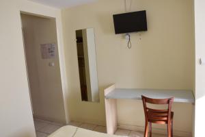 TV a/nebo společenská místnost v ubytování Hotel Gai Relais