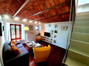 a living room with a couch and a table at Almocabar Luxury Apartment in Ronda