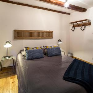 Postel nebo postele na pokoji v ubytování La Maison du Batelier