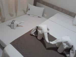 Cama ou camas em um quarto em Âncoradouro Hotel