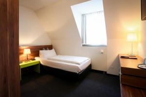 Postel nebo postele na pokoji v ubytování Hotel Schempp