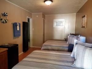 Postel nebo postele na pokoji v ubytování Canton Motel