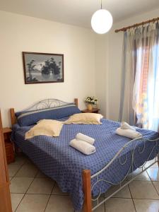 Posteľ alebo postele v izbe v ubytovaní Ifigenia Apartments