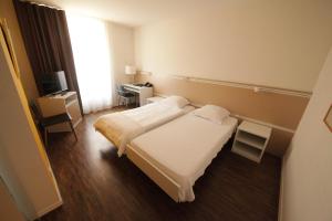 Letto o letti in una camera di Auberge de Prangins