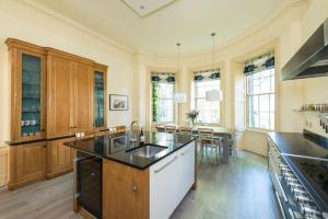 a large kitchen with a sink and a counter at Gayfield Place in Edinburgh