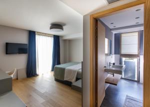 Postel nebo postele na pokoji v ubytování Buzë Boutique Hotel