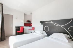 two beds in a hotel room with red chairs at Le Carmin by Popinns in Vitry-sur-Seine