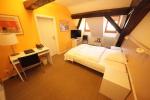 Ein Bett oder Betten in einem Zimmer der Unterkunft Auberge de Prangins