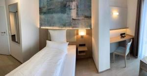 Ein Bett oder Betten in einem Zimmer der Unterkunft Thermalhotel Kemper