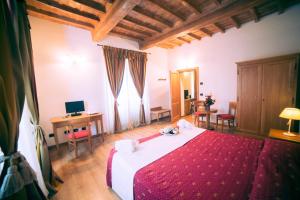 Postel nebo postele na pokoji v ubytování HG Abetone e Piramidi Resort