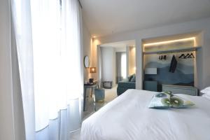 Posteľ alebo postele v izbe v ubytovaní Boutique Hotel de la Ville