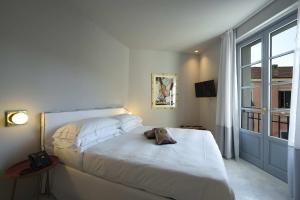 Posteľ alebo postele v izbe v ubytovaní Boutique Hotel de la Ville
