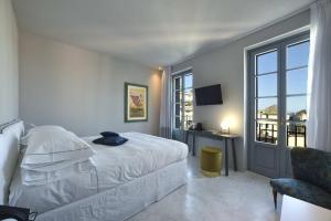 Posteľ alebo postele v izbe v ubytovaní Boutique Hotel de la Ville