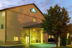 a hotel with a sign on the side of a building at Days Inn by Wyndham Mount Vernon in Mount Vernon