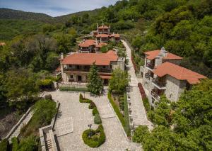 an aerial view of a large house in the mountains at Abeliona Retreat in Ambeliona