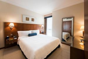 Postel nebo postele na pokoji v ubytování Al Rawda Arjaan by Rotana, Abu Dhabi