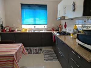 a kitchen with a sink and a counter top at Casa Aurora in Penacova