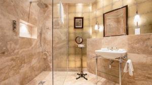 a bathroom with a sink and a shower at Hever Castle Luxury Bed and Breakfast in Edenbridge