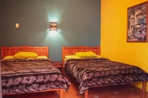 Ένα ή περισσότερα κρεβάτια σε δωμάτιο στο Planet Hostel