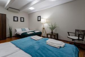 Łóżko lub łóżka w pokoju w obiekcie Apartamenty na Starówce / Old Town apartments