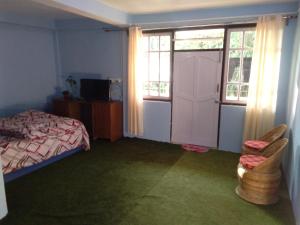 Postel nebo postele na pokoji v ubytování Bethany Homestay