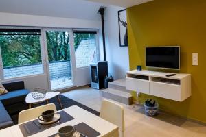 TV a/nebo společenská místnost v ubytování Côté terrasse