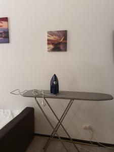 a table in a room next to a wall at My Little Room in Constanţa