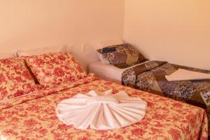Postel nebo postele na pokoji v ubytování POUSADA TUPINAMBA