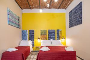 Ένα ή περισσότερα κρεβάτια σε δωμάτιο στο Galluppi Design Apartment By HouseinNaples