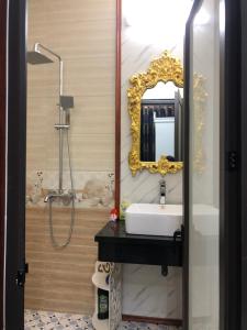 a bathroom with a sink and a mirror at Elisa Hotel in Ninh Binh +42 photos