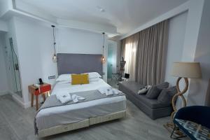 Postel nebo postele na pokoji v ubytování Blue Bottle Boutique Hotel