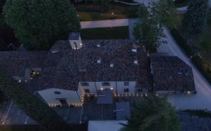 an overhead view of a large house with lights on it at Corte San Ruffillo Country Resort in Dovadola