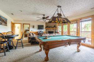 a living room with a pool table at Closer to Home in Gatlinburg