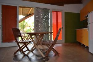 a wooden table and two chairs in a kitchen at Relax in Vieste