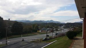 a view of a road with mountains in the distance at Nakon Motel in Candler