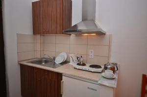 Kuchyň nebo kuchyňský kout v ubytování Marilena Apartments & Studios