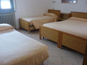 Postel nebo postele na pokoji v ubytování Hotel Milano