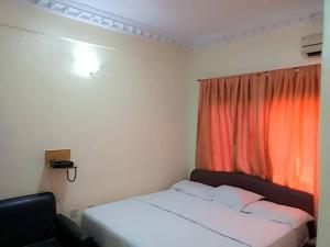 Llit o llits en una habitació de JCB Hotel