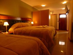 Katil atau katil-katil dalam bilik di Garden House Hotel