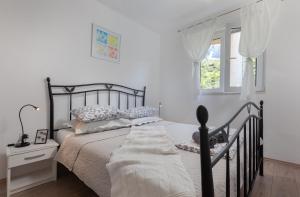 Posteľ alebo postele v izbe v ubytovaní Sea view Ela Apartments