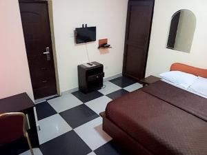 Llit o llits en una habitació de JCB Hotel
