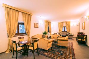 Posezení v ubytování HG Abetone e Piramidi Resort