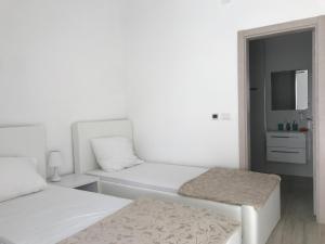 Letto o letti in una camera di First line of the sea 1
