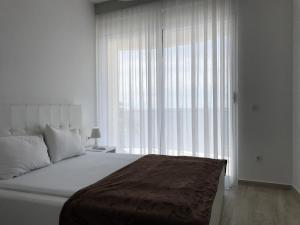 Letto o letti in una camera di First line of the sea 1