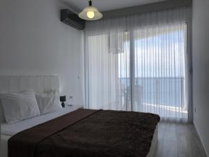 Letto o letti in una camera di First line of the sea 1