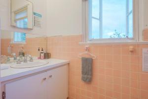 a bathroom with a sink and a mirror at Hillcrest in Nassau +53 photos