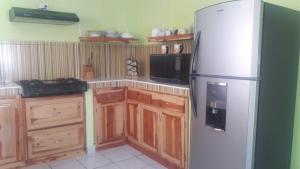 Kuchyň nebo kuchyňský kout v ubytování Villas La Quinta