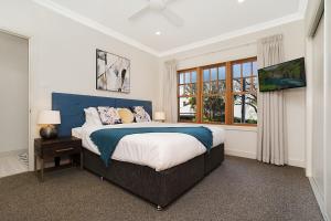 Llit o llits en una habitació de Accommodation Hunter - Adams Street Maitland