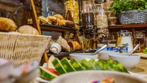 a table topped with lots of different types of food at Five Stars Bed&Breakfast in Wrocław
