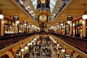 a large shopping mall with a clock on the ceiling at 1 Private Double Bed with En-suite Bathroom in Sydney CBD near Train UTS DarlingHar&ICC&C hinatown - ROOM ONLY in Sydney